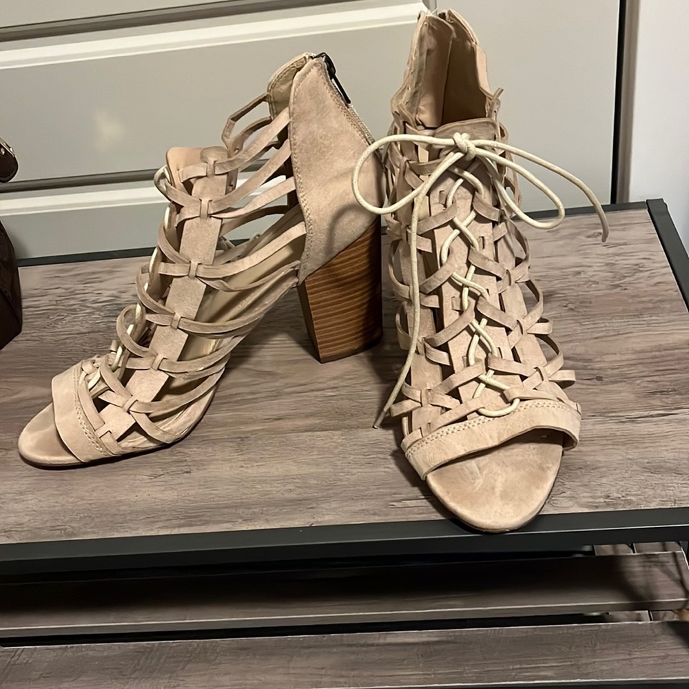 Fun lace up open toed booties.